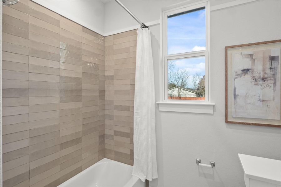 Full bath with shower / tub combo and toilet Full bath with shower / tub combo and toilet