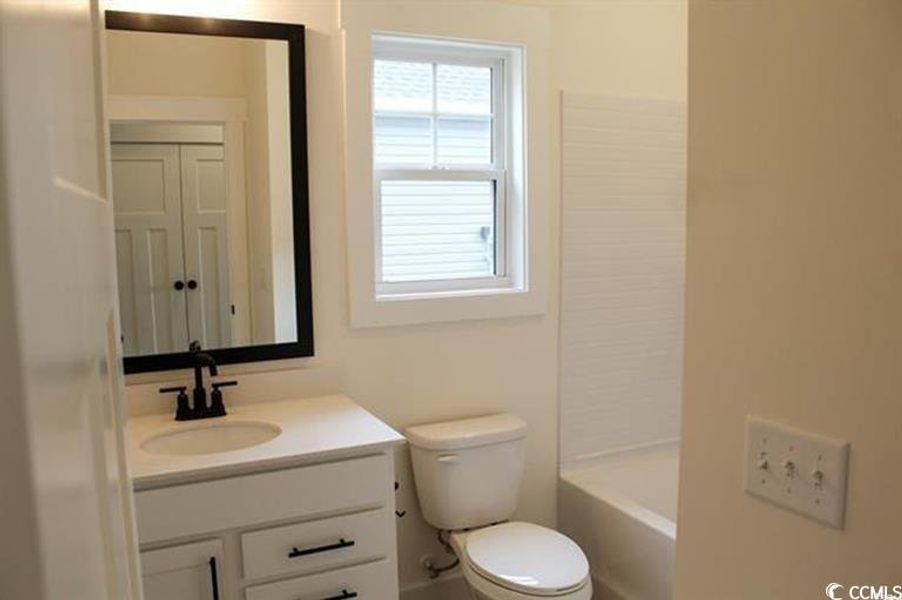 Full bathroom featuring vanity and bathing tub / shower combination
