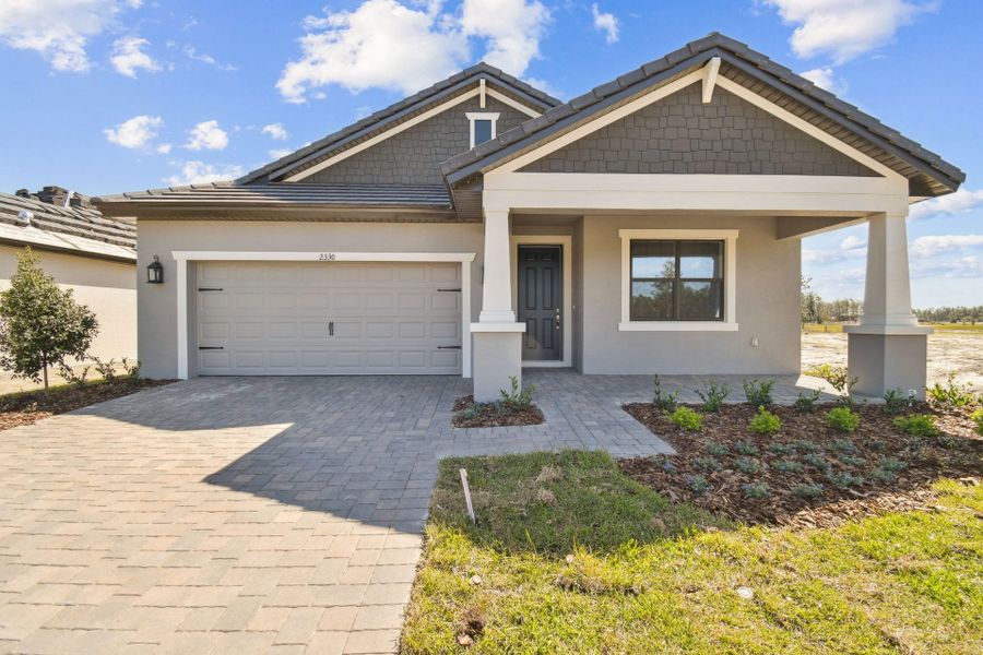 Representative exterior photo of a completed home built from the Solana II by William Ryan Homes in Pinecone Reserve, Brooksville, FL (Image 14). Representative exterior photo of a completed home built from the Solana II by William Ryan Homes in Pinecone Reserve, Brooksville, FL (Image 14).
