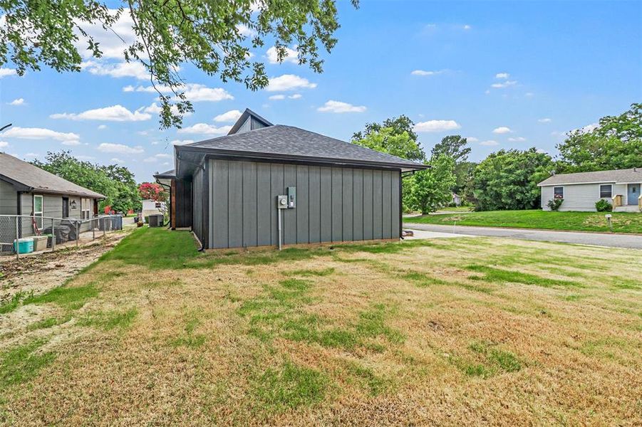 View of shed / structure featuring a yard