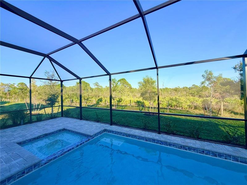 Exterior details and patio area of a home in Island Lakes at Coco Bay: Manor Homes, Englewood (Image 3).
