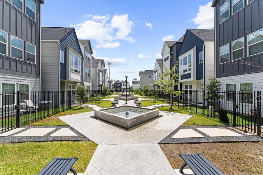 This beautifully landscaped courtyard is the centerpiece of the neighborhood, where graceful pergolas provide shaded retreats and elegant water fountains add a soothing ambiance.
