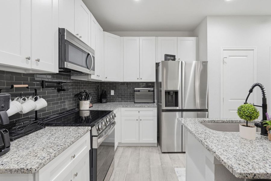 Furnished interior view inside a new home in Arrowhead Lakes, Willis (Image 7).