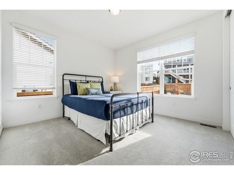 Main-level bedroom offering flexibility for guests, a home office, or everyday use.