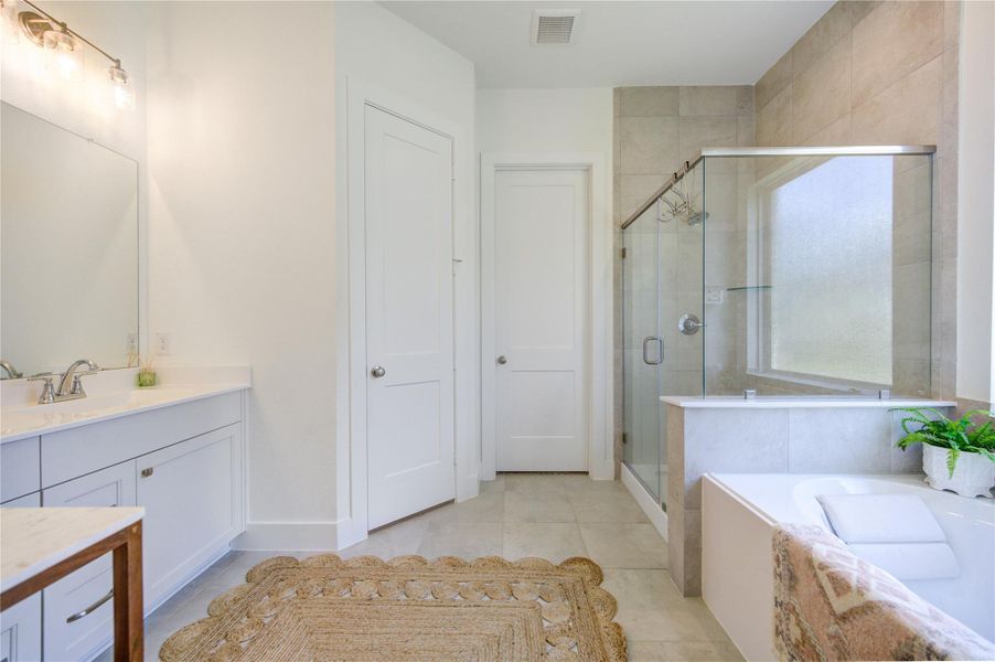 The primary bath features a bright layout designed for both function and everyday ease. The primary bath features a bright layout designed for both function and everyday ease.