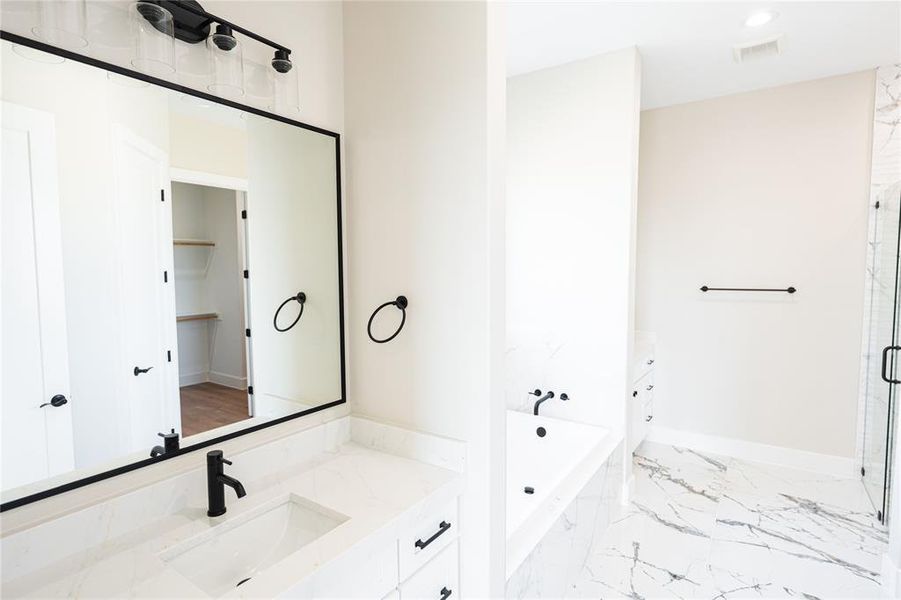 Full bathroom with vanity, a garden tub, a marble finish shower, light marble finish flooring, and recessed lighting