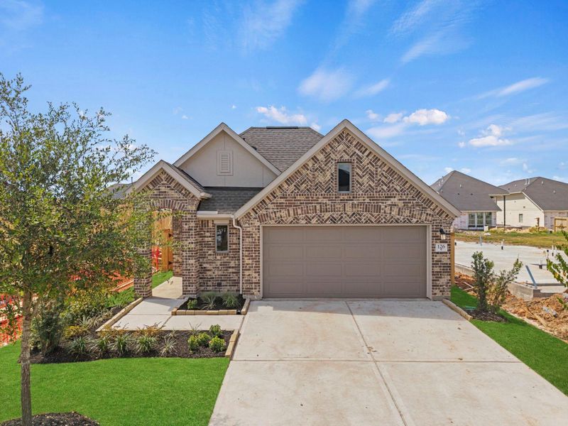 Front exterior of a new home in Candela, Richmond, TX, highlighting curb appeal (Image 20).