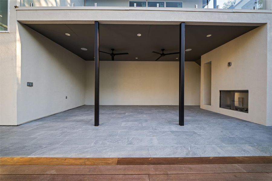 Lower level patio with outdoor fireplace and (to be built) outdoor cabinets with refrigerator