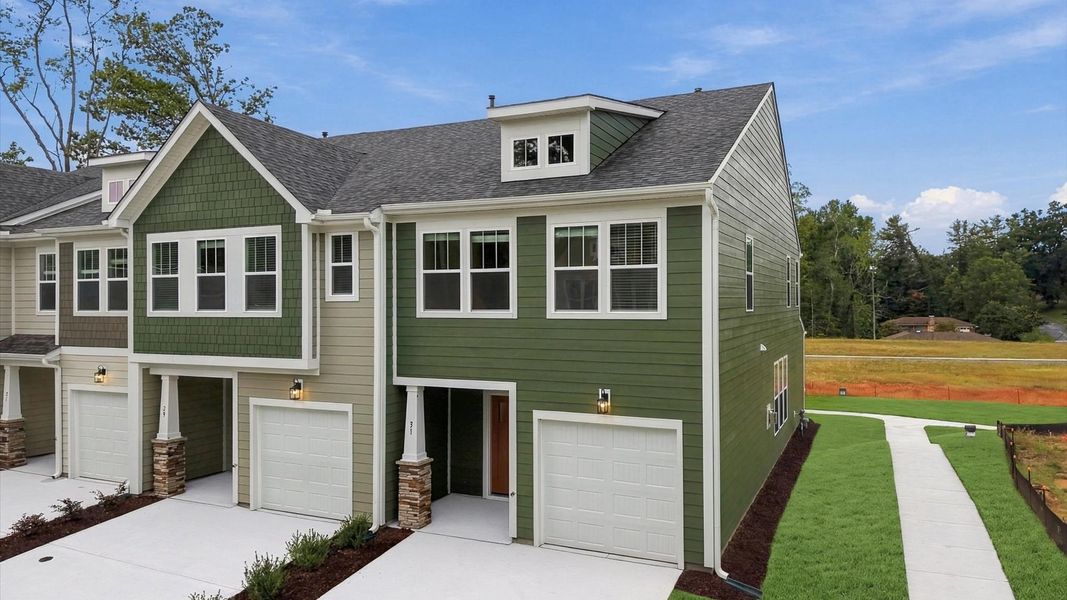 Front exterior of a new home in Brookland Place, Hendersonville, NC, highlighting curb appeal (Image 22). Front exterior of a new home in Brookland Place, Hendersonville, NC, highlighting curb appeal (Image 22).