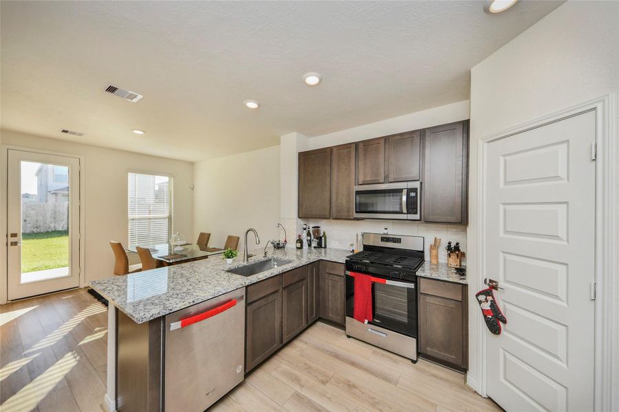 Furnished interior view inside a new home in Sunterra North, Katy (Image 34).