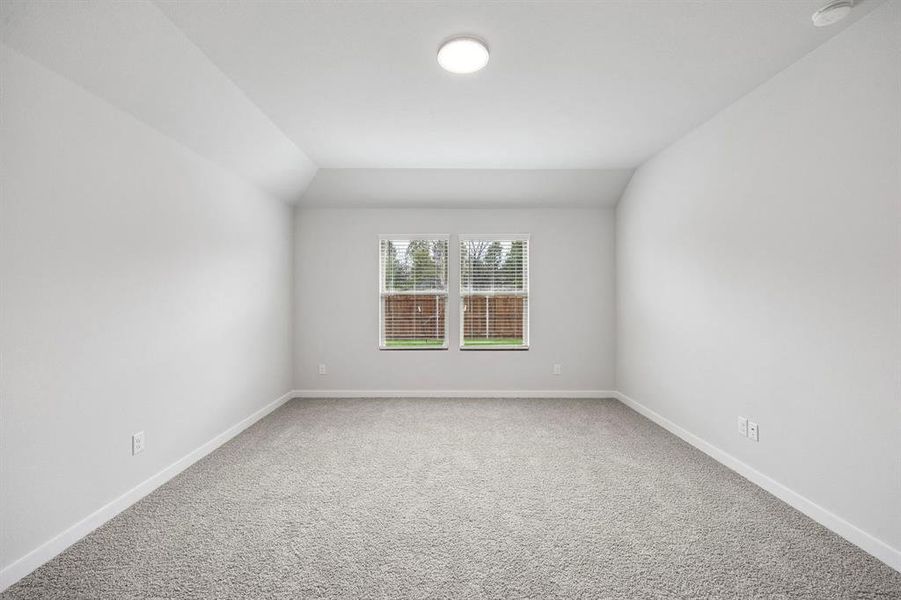 Primary Suite in the Heisman home plan by Trophy Signature Homes – REPRESENTATIVE PHOTO