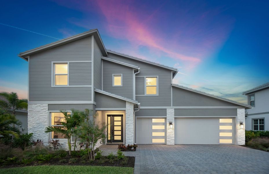 Front exterior of a new home in Avondale at Avenir, Palm Beach Gardens, FL, highlighting curb appeal (Image 1).