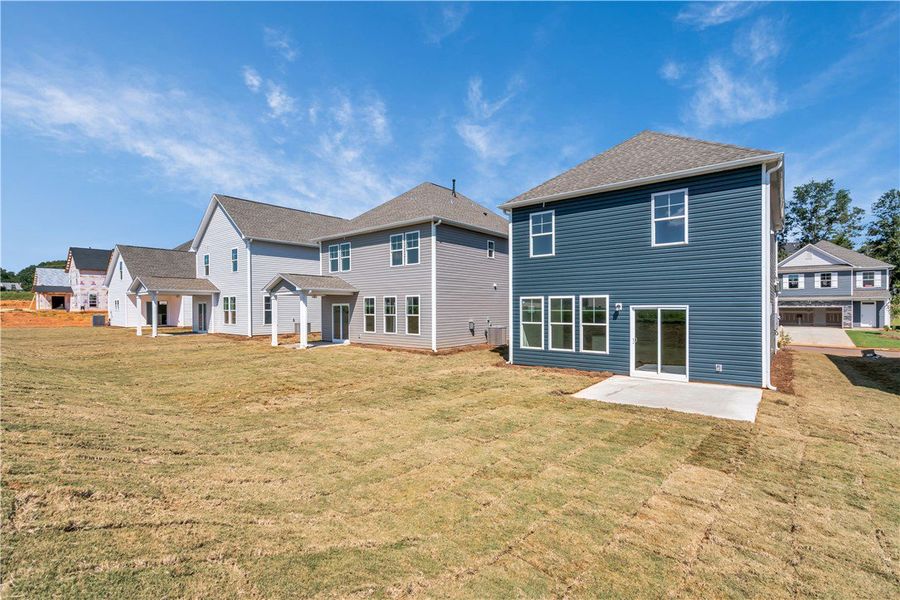 Front exterior of a new home in Brownstone Park, Easley, SC, highlighting curb appeal (Image 14).