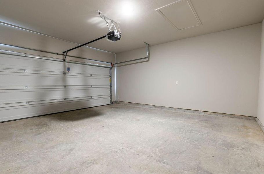 Garage featuring a garage door opener Garage featuring a garage door opener