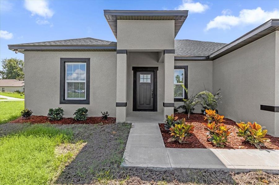 Front exterior of a new home in , Ocala, FL, highlighting curb appeal (Image 17).
