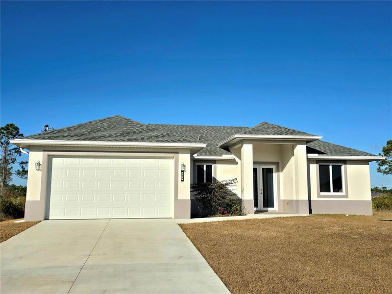 Front exterior of a new home in , Lehigh Acres, FL, highlighting curb appeal (Image 2). Front exterior of a new home in , Lehigh Acres, FL, highlighting curb appeal (Image 2).