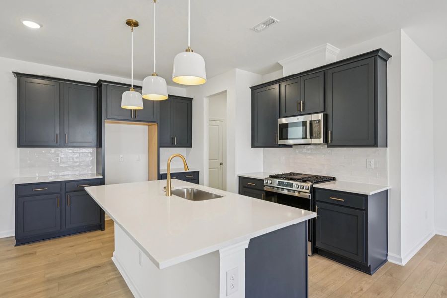 Kitchen featuring the AW Collection® Sapphire - Vibrant blues and crisp whites steal the show.