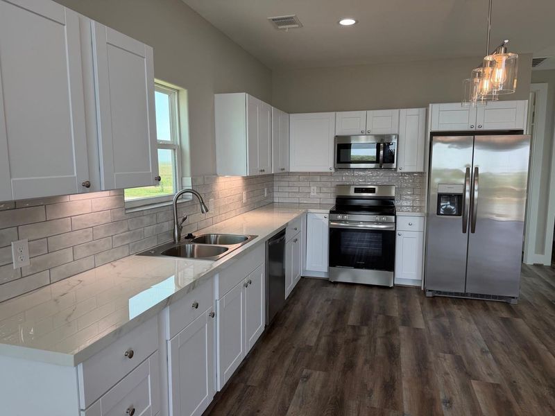 Granite countertops and stainless steel appliances