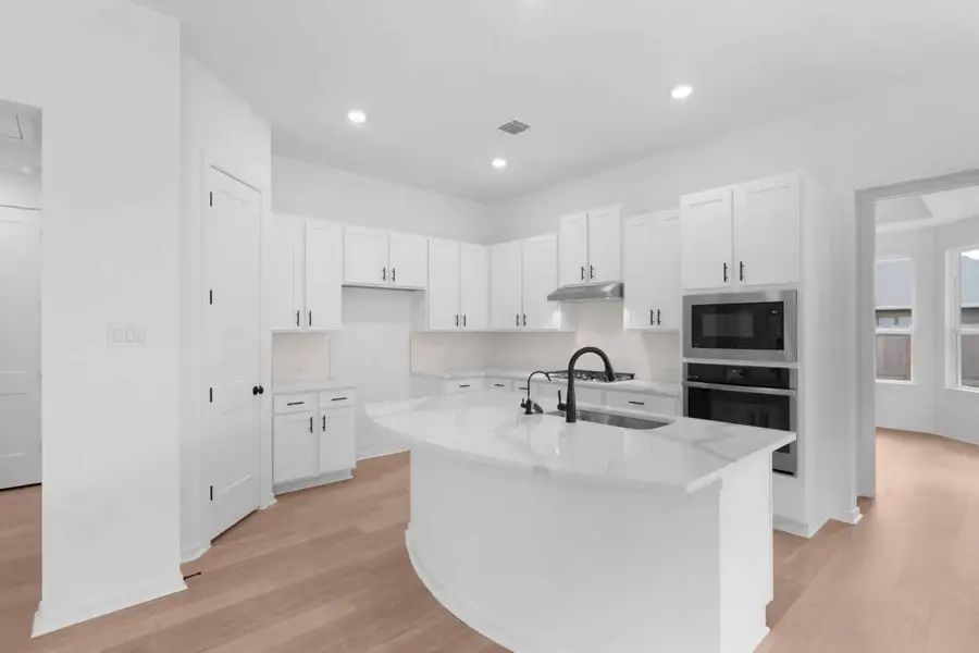 Furnished interior view inside a new home in Carillon, Manor (Image 5).