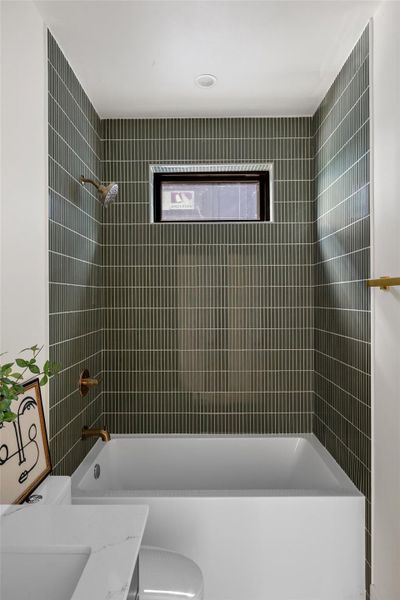 Full bathroom with shower / washtub combination and vanity Full bathroom with shower / washtub combination and vanity