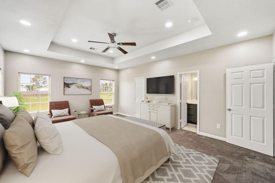 Virtually Staged: A modern ceiling fan provides comfort and style, and the oversized layout offers ample space for a sitting area or additional furnishings. Designed with both comfort and sophistication in mind, this primary bedroom creates the perfect place to unwind.