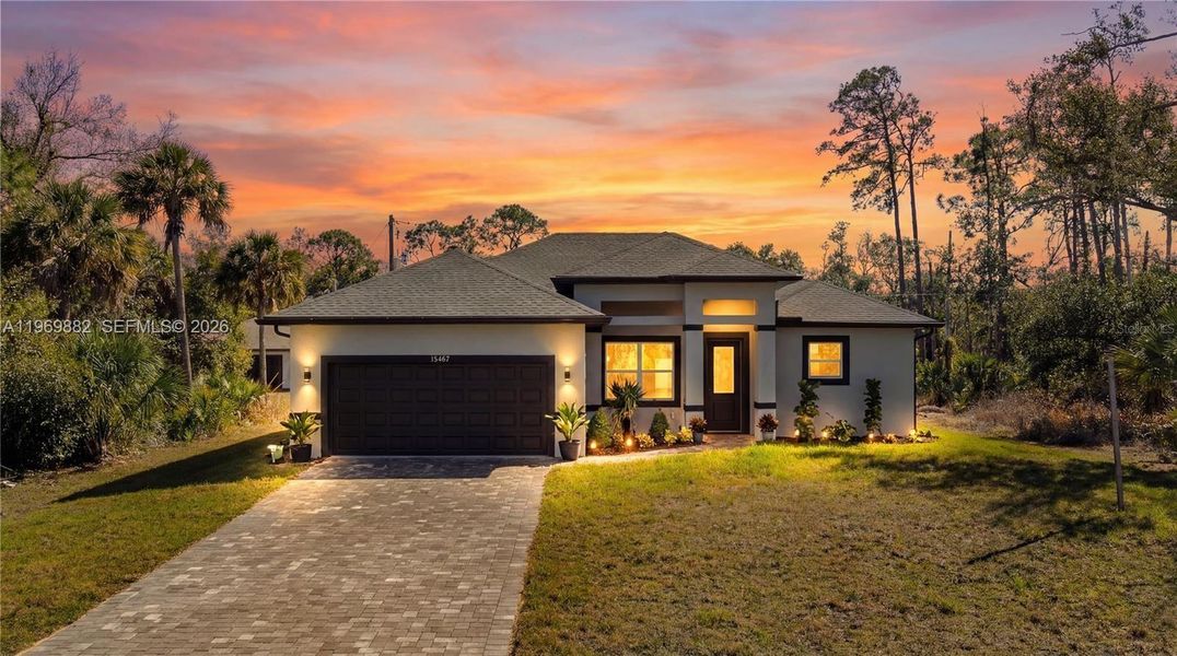 Front exterior of a new home in , Port Charlotte, FL, highlighting curb appeal (Image 24).