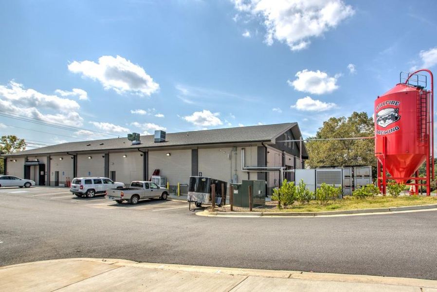 Front exterior of a new home in , Suwanee, GA, highlighting curb appeal (Image 26).