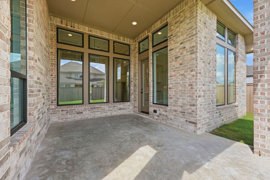 Exterior details and patio area of a home in Bridgeland 50′, Cypress (Image 4).