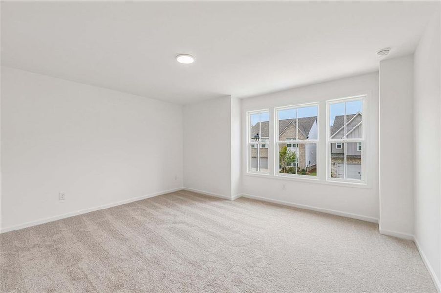 Spacious, unfurnished interior of a new home in Eastlyn Crossing, Flowery Branch (Image 28).