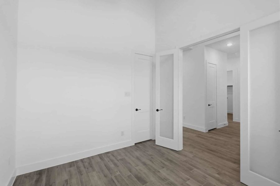 Representative unfurnished interior of a home built from the Sorenstam by Chesmar Homes in Riceland Alley Loads, Mont Belvieu (Image 58).