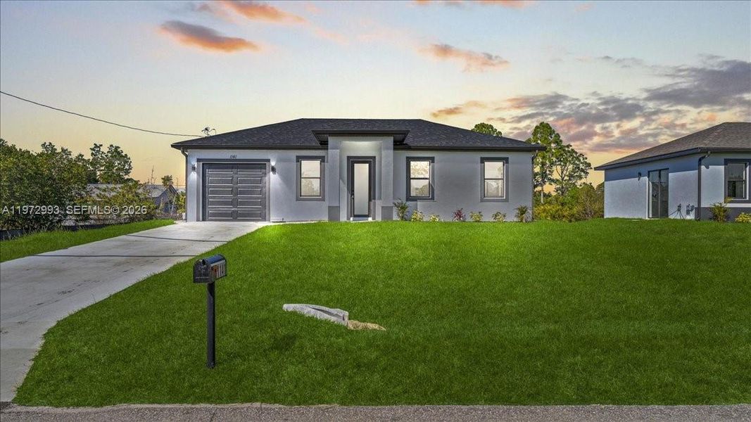 Front exterior of a new home in , Lehigh Acres, FL, highlighting curb appeal (Image 21).