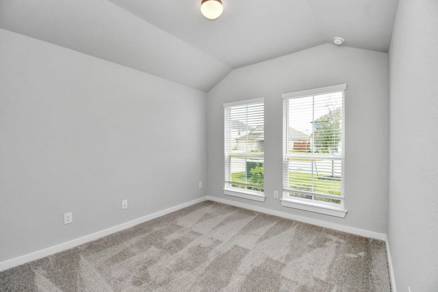 Generously sized secondary bedrooms featuring spacious closets, soft and inviting carpeting underfoot, large windows allowing plenty of natural light, and the added touch of privacy blinds for your personal retreat.