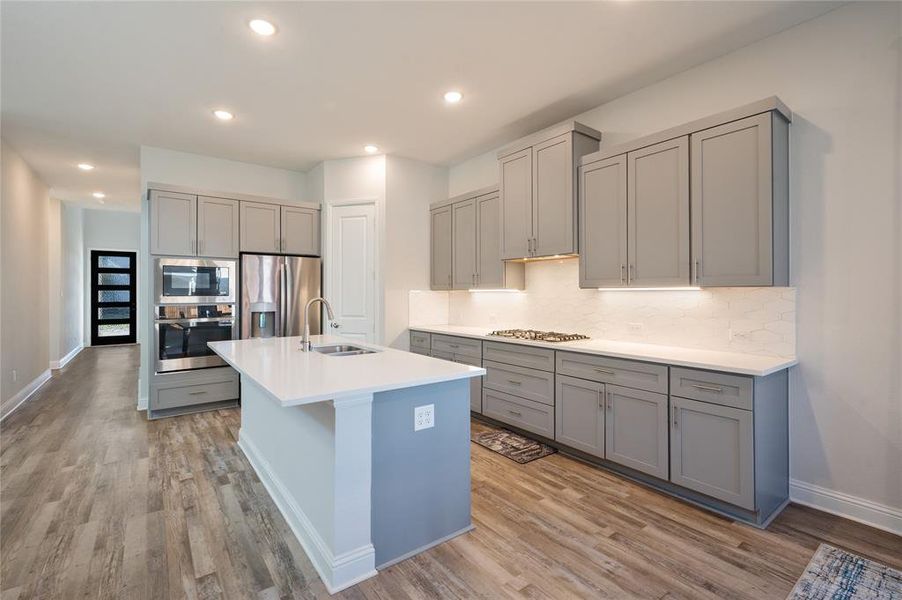 Beautiful shaker style cabinetry and all stainless steel appliances.