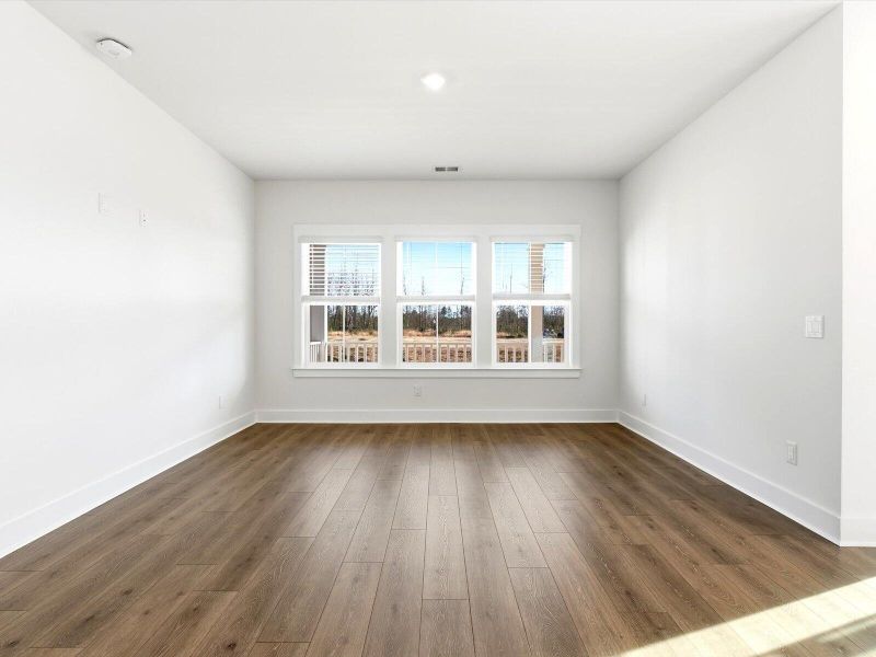 Spacious, unfurnished interior of a new home in The Coves at Lakes of Cane Bay, Summerville (Image 12).
