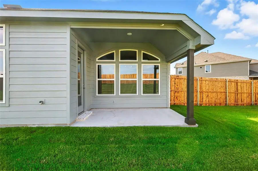 Back of house with a patio Back of house with a patio
