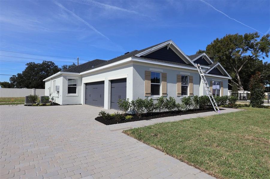 Front exterior of a new home in Willow Run, Apopka, FL, highlighting curb appeal (Image 18). Front exterior of a new home in Willow Run, Apopka, FL, highlighting curb appeal (Image 18).