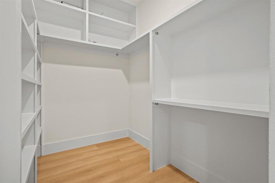 Walk in closet featuring hardwood / wood-style floors