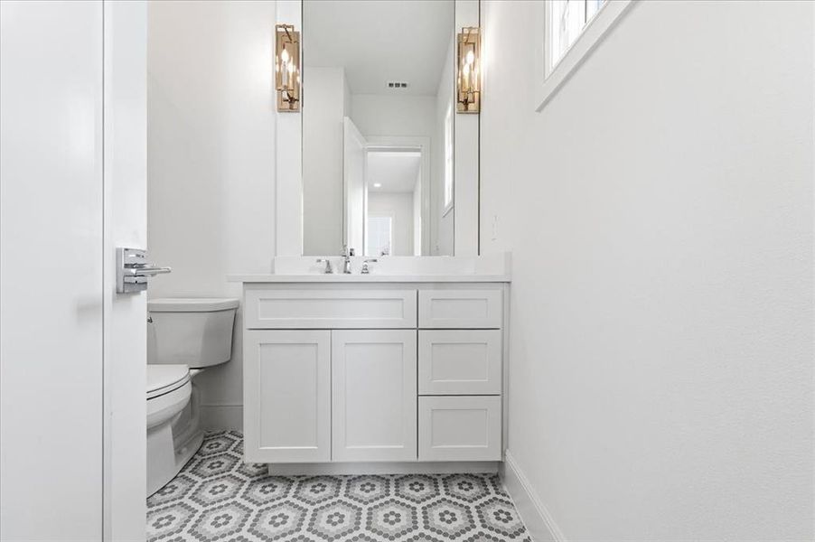 Secondary bedroom on main level with ensuite bath