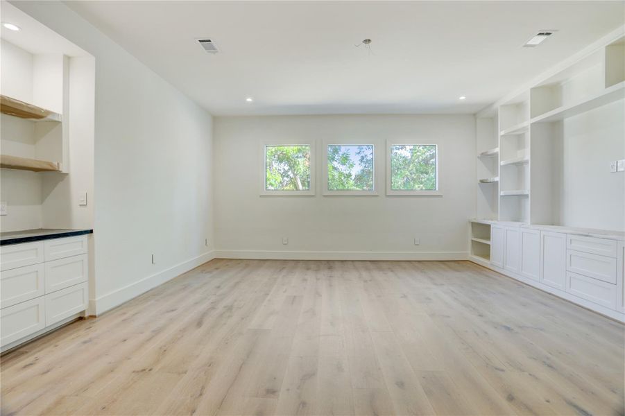 The upstairs gameroom is equipped with built-ins, cabinetry, wet bar and beverage center. The upstairs gameroom is equipped with built-ins, cabinetry, wet bar and beverage center.