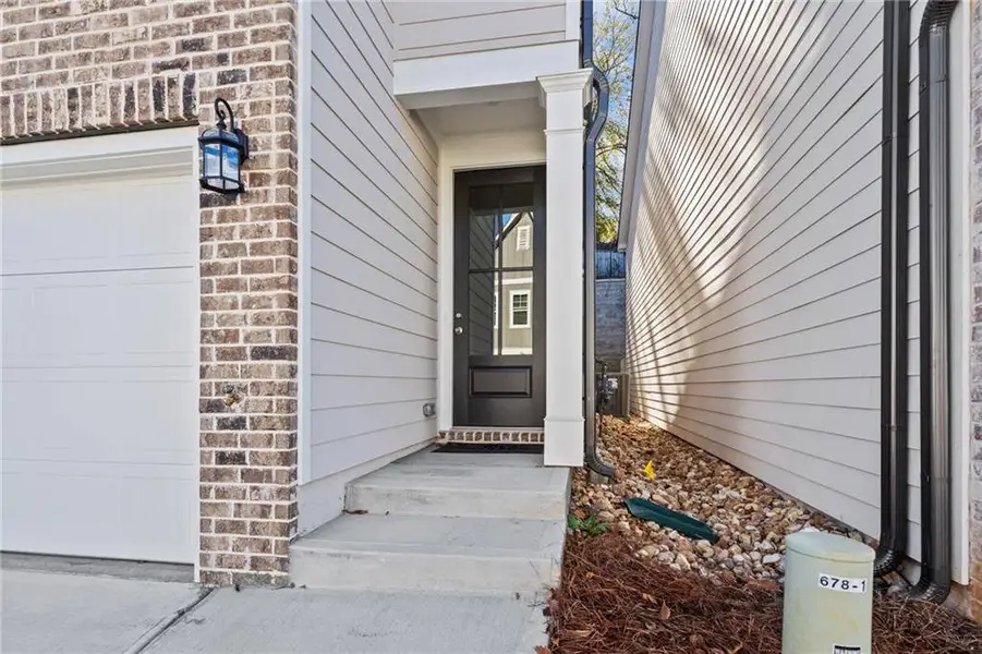 Exterior details and patio area of a home in The Village at Shallowford, Kennesaw (Image 3).