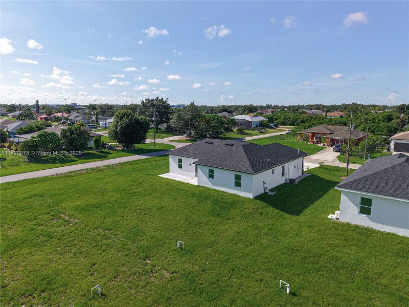 Front exterior of a new home in , Lehigh Acres, FL, highlighting curb appeal (Image 1).