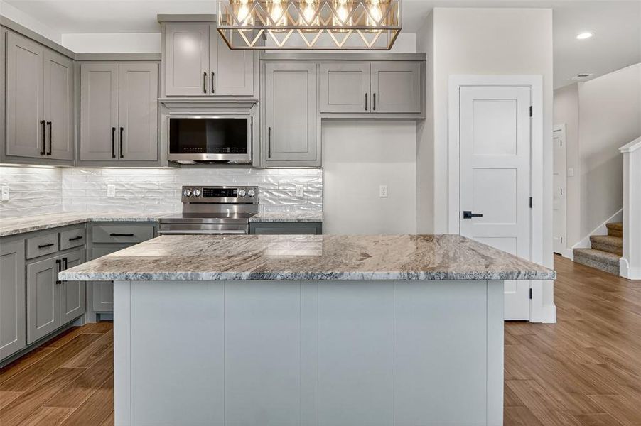 wonderful kitchen, custom cabinets, stainless steel appliances and an amazing island
