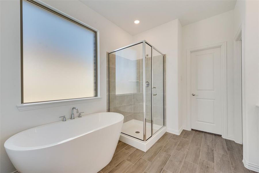 Bathroom featuring separate shower and tub