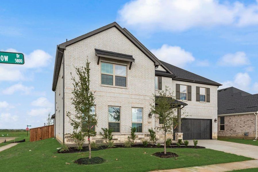 Front exterior of a new home in Sutton Fields, Celina, TX, highlighting curb appeal (Image 22).