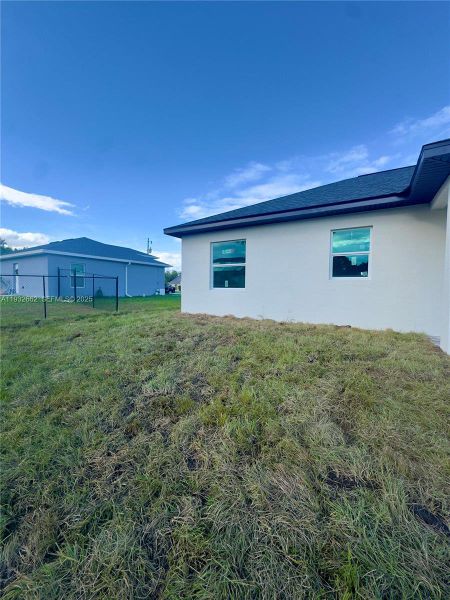 Exterior details and patio area of a home in , Lehigh Acres (Image 3).