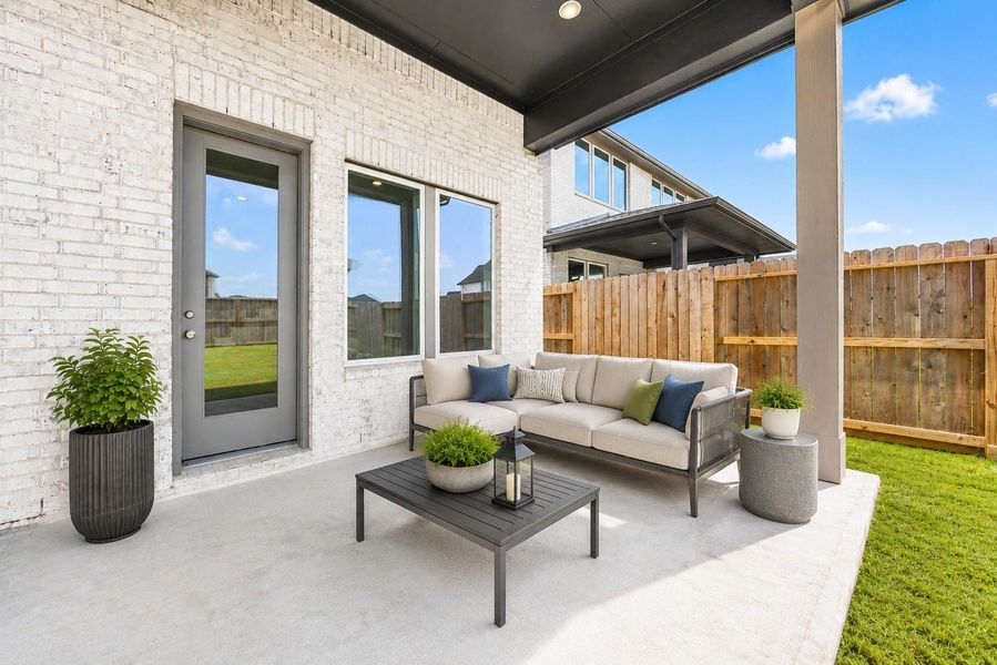 A covered back patio extends the living space outdoors, offering a shaded spot to unwind and direct access into the home. Virtually staged. A covered back patio extends the living space outdoors, offering a shaded spot to unwind and direct access into the home. Virtually staged.
