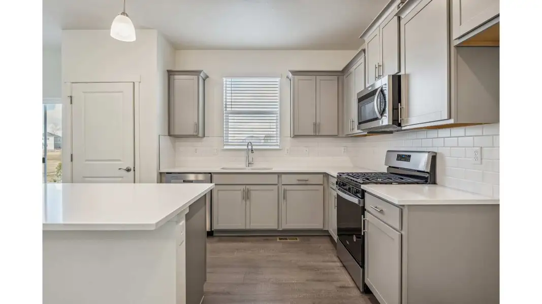 Representative furnished interior of a home built from the ELDER II by D.R. Horton in The Ridge at Lorson Ranch, Colorado Springs (Image 9).