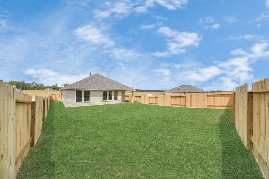 Front exterior of a new home in The Canopies, Splendora, TX, highlighting curb appeal (Image 16). Front exterior of a new home in The Canopies, Splendora, TX, highlighting curb appeal (Image 16).