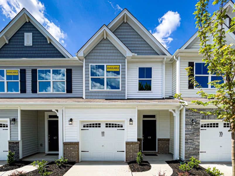 Front exterior of a new home in Fairview Village Townhomes, Simpsonville, SC, highlighting curb appeal (Image 1). Front exterior of a new home in Fairview Village Townhomes, Simpsonville, SC, highlighting curb appeal (Image 1).