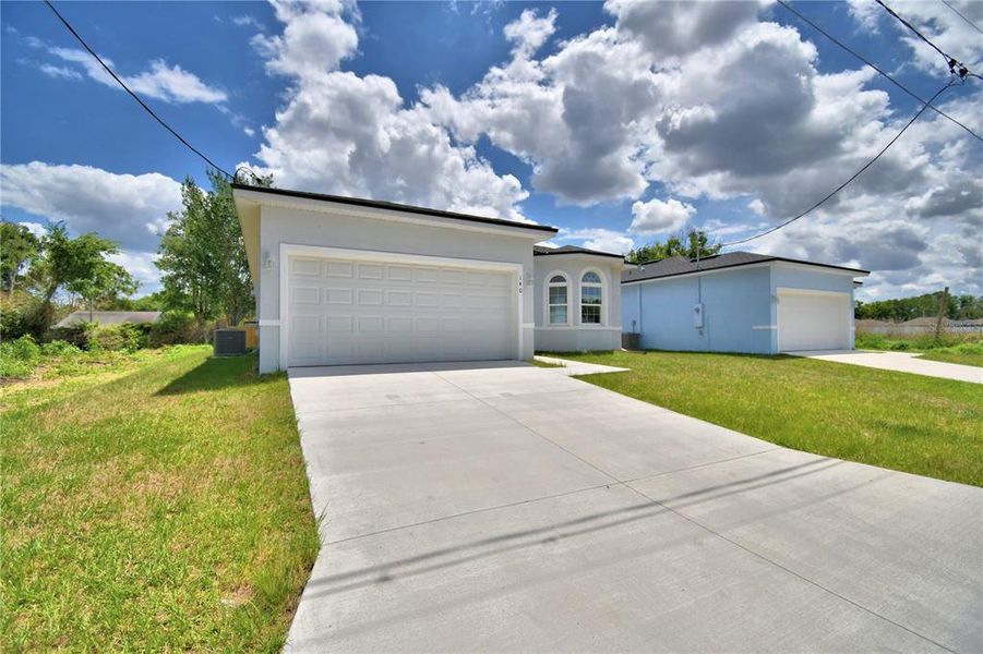 Front exterior of a new home in , Winter Haven, FL, highlighting curb appeal (Image 19).